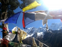 Prayer flag and Ganesh Himal view from Milarepa Cave