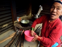 Local lady prepares lunch in Forest camp