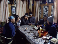 Trekker enjoy the card game after dinner in Langtang