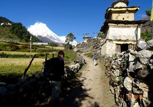 Buddhist Prayer wall and Mount Manaslu in the background